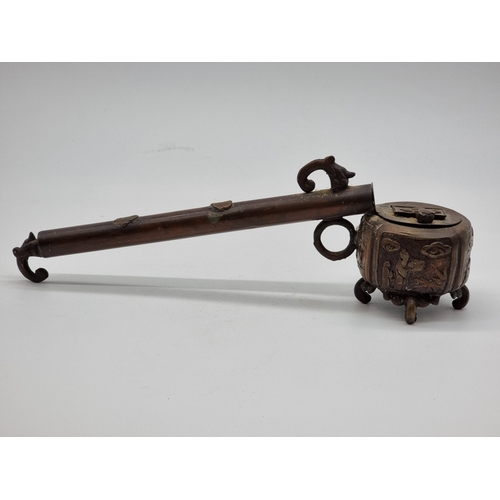 1540 - A Japanese bronze yatate, 33cm long; together with an Ottoman bronze divit, 25cm long, (lacking hing... 