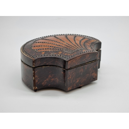 1547 - A simulated tortoiseshell and hobnail studded shell form casket, 18.5cm wide, (warped).... 