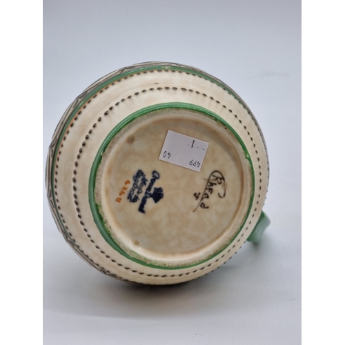 1559 - A Crown Ducal 'Charlotte Rhead' jug, 12.5cm high; together with an Art Deco Myott jug, 19cm high; an... 