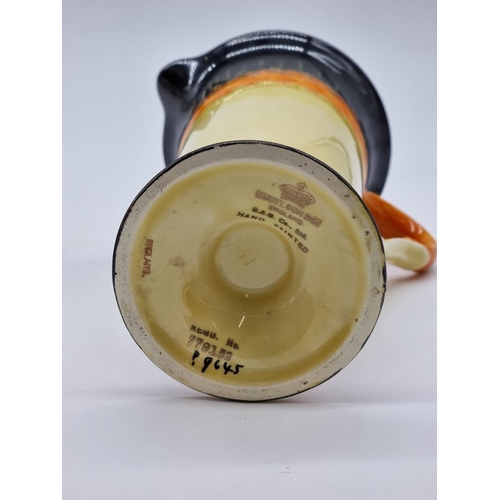 1559 - A Crown Ducal 'Charlotte Rhead' jug, 12.5cm high; together with an Art Deco Myott jug, 19cm high; an... 