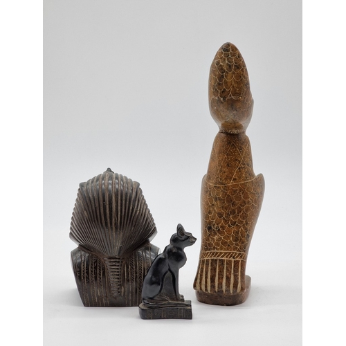 1574 - Three Egyptian style figures, the soapstone Horus 27.5cm high.