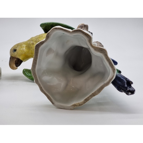 1575 - Three similar Continental porcelain Parrots, largest 30cm high, (s.d. to largest and smallest).... 