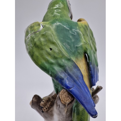 1575 - Three similar Continental porcelain Parrots, largest 30cm high, (s.d. to largest and smallest).... 