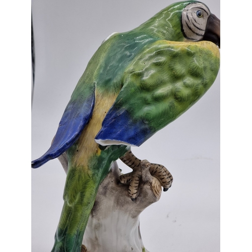 1575 - Three similar Continental porcelain Parrots, largest 30cm high, (s.d. to largest and smallest).... 