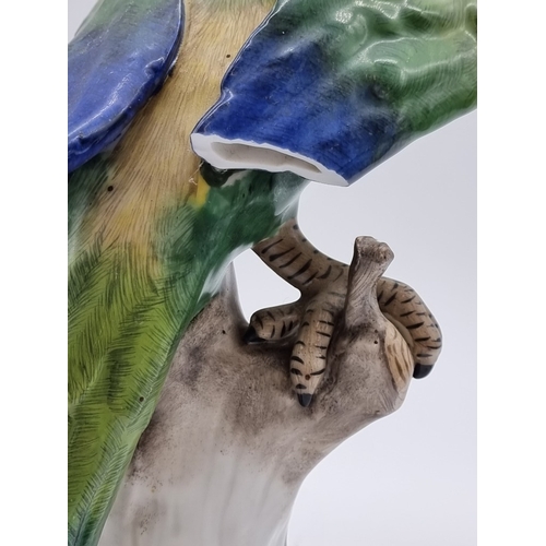 1575 - Three similar Continental porcelain Parrots, largest 30cm high, (s.d. to largest and smallest).... 