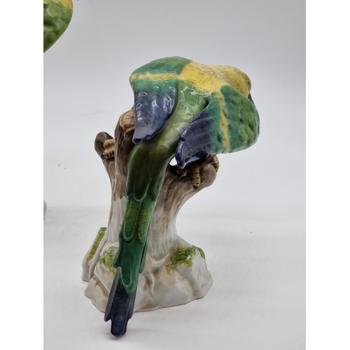 1575 - Three similar Continental porcelain Parrots, largest 30cm high, (s.d. to largest and smallest).... 