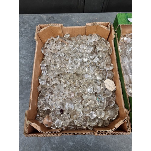 1586 - A large quantity of faceted glass chandelier, lustre drops and similar. (two boxes)