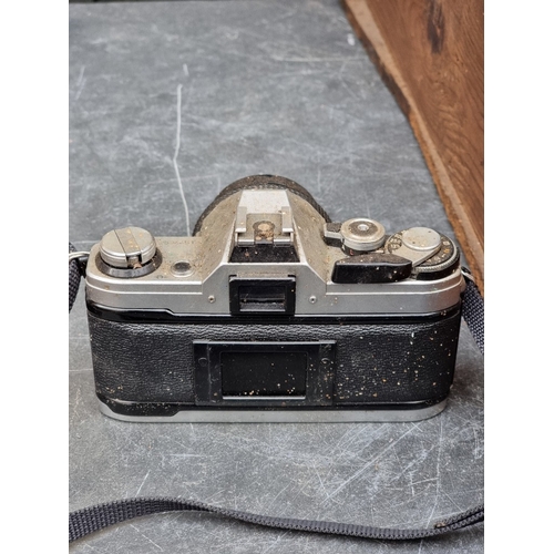 1593 - Cameras: a large collection of vintage cameras, lenses and related, to include binoculars.... 