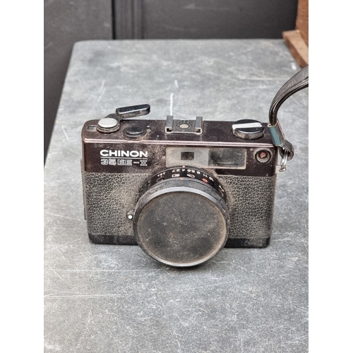 1593 - Cameras: a large collection of vintage cameras, lenses and related, to include binoculars.... 