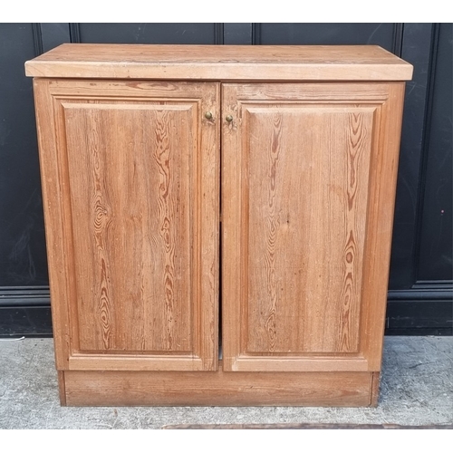 1100 - A panelled pine two drawer side cabinet, 102.5cm wide.