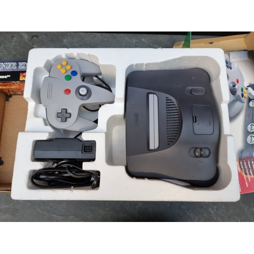 1647 - Video Games: a Nintendo 64 console; together with one official and one third party controller; an 'E... 