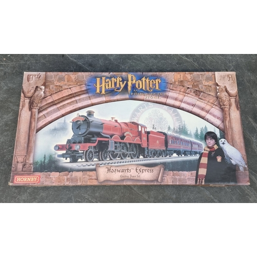1649 - A Hornby 'Hogwarts Express' train set, (R.1025), from Harry Potter and The Philosopher's Stone.... 