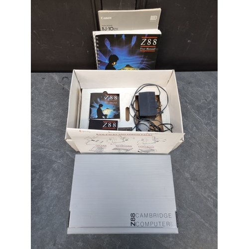 A Cambridge Z88 computer, boxed with instructions.