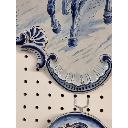 1674 - A pair of 19th century Dutch Delft wall plaques, each painted with a pony and trap, 55 x 40cm.... 