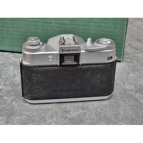1597 - Cameras: a Voightlander 'Bessamatic', with Voightlander 'Color-Skopar X 1:2.8/50' lens, in leather c... 