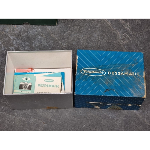 1597 - Cameras: a Voightlander 'Bessamatic', with Voightlander 'Color-Skopar X 1:2.8/50' lens, in leather c... 