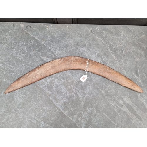 1663 - Ethnographica: a 19th century Australian Aboriginal hardwood boomerang, the upper convex side with f... 