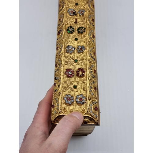 1664 - A Burmese Buddhist palm leaf manuscript or parabaik, with gilded edges and carved and 'gem set' bind... 