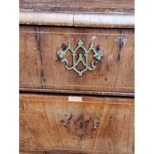 1025 - An 18th century walnut, line inlaid and crossbanded chest of drawers, on bun feet, 94.5cm wide.... 