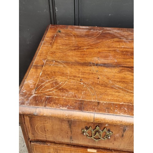 1025 - An 18th century walnut, line inlaid and crossbanded chest of drawers, on bun feet, 94.5cm wide.... 