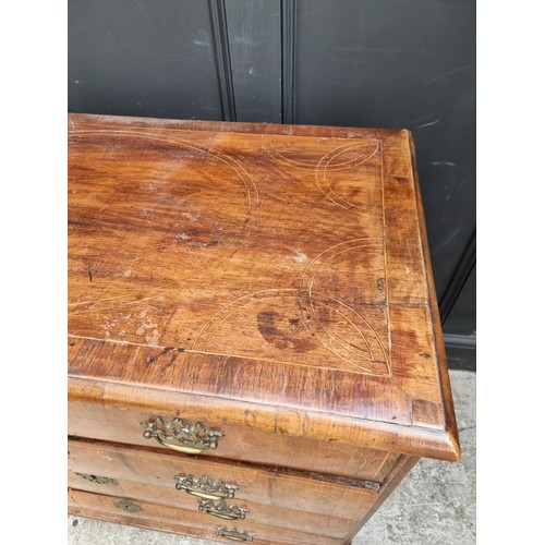 1025 - An 18th century walnut, line inlaid and crossbanded chest of drawers, on bun feet, 94.5cm wide.... 