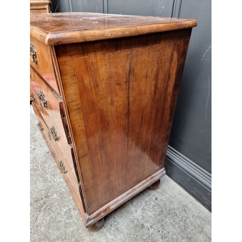 1025 - An 18th century walnut, line inlaid and crossbanded chest of drawers, on bun feet, 94.5cm wide.... 