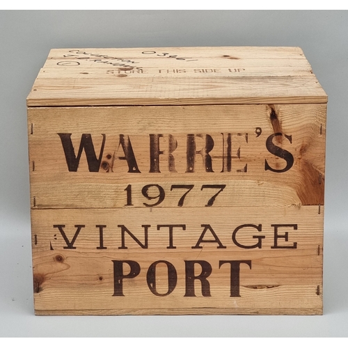 A case of twelve 75cl bottles of Warre's 1977 Vintage Port, in owc.