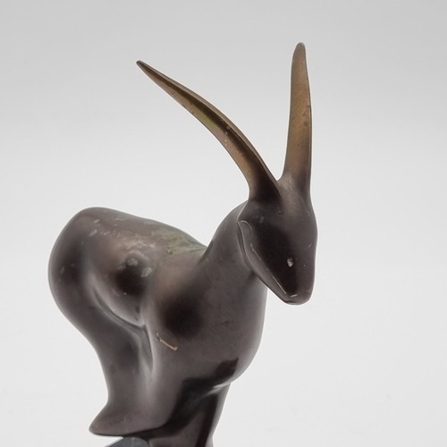 1520 - A bronze Ibex, on marble base, 23cm high.