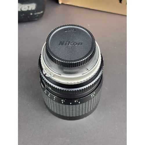 1400 - Cameras: a Nikon FE2 with Micro-Nikkor 55mm 1:3.5 lens; and a Hoya HMC 28-55mm 1:4 lens, box associa... 