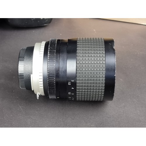 1400 - Cameras: a Nikon FE2 with Micro-Nikkor 55mm 1:3.5 lens; and a Hoya HMC 28-55mm 1:4 lens, box associa... 