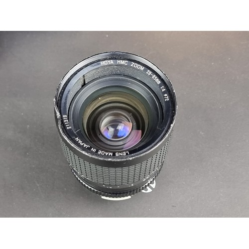 1400 - Cameras: a Nikon FE2 with Micro-Nikkor 55mm 1:3.5 lens; and a Hoya HMC 28-55mm 1:4 lens, box associa... 