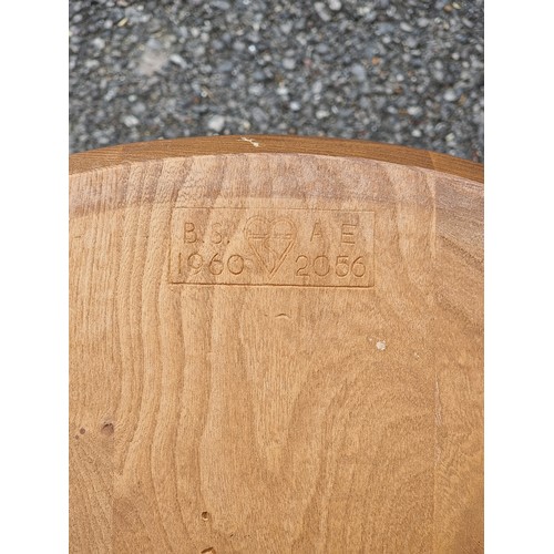 1073 - A mid-century Ercol blonde dining suite, comprising: a Windsor table, 152cm long; and a set of six '... 