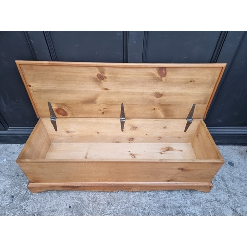 1001 - A large pine coffer, 139cm wide.