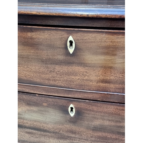 1038 - An early 19th century bowfront four drawer chest, with bone escutcheons, 120cm wide.... 