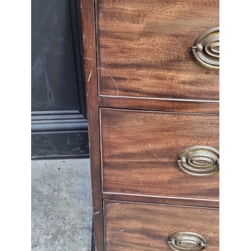 1038 - An early 19th century bowfront four drawer chest, with bone escutcheons, 120cm wide.... 