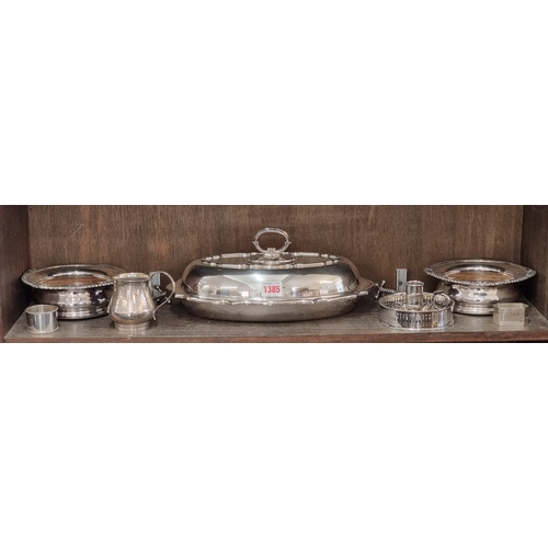 1385 - A small group of silver plate, to include a pair of bottle coasters. (10)