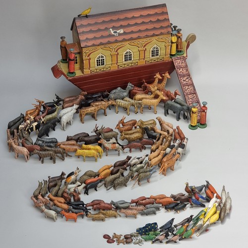 A good late 19th century German Noah's Ark set, probably Erzgebirge, with sixty five carved and finely painted pairs of figures, largest 12cm high, the Ark 53.5cm long.