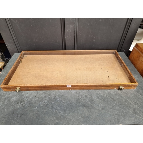 A mahogany table top shallow display case, 6cm high x 96.5cm wide x ...