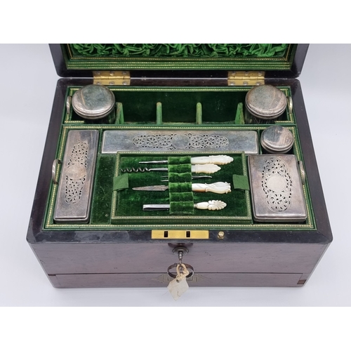1449 - A Victorian rosewood and brass bound toilet box, the interior inscribed 'F. L. Hausburg, Manufacture... 