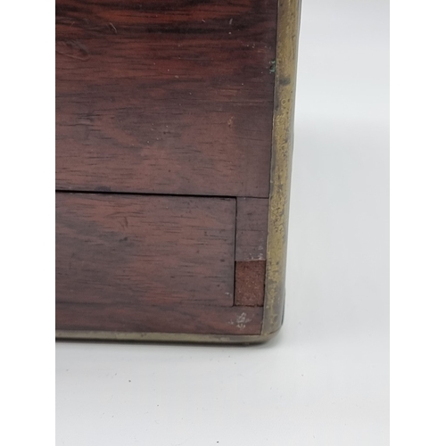 1449 - A Victorian rosewood and brass bound toilet box, the interior inscribed 'F. L. Hausburg, Manufacture... 