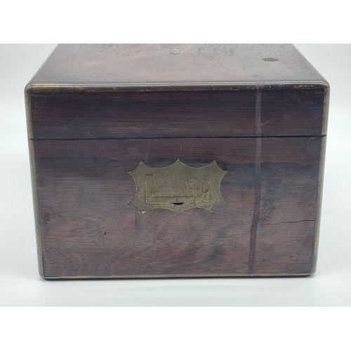 1449 - A Victorian rosewood and brass bound toilet box, the interior inscribed 'F. L. Hausburg, Manufacture... 