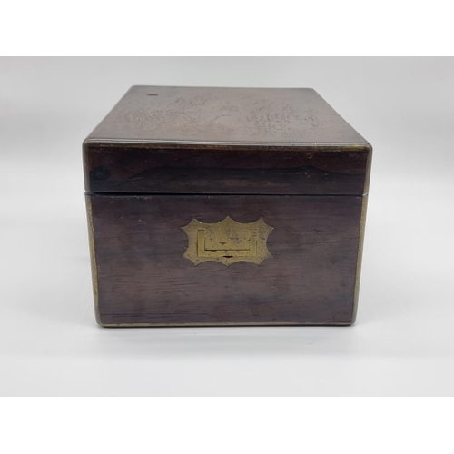 1449 - A Victorian rosewood and brass bound toilet box, the interior inscribed 'F. L. Hausburg, Manufacture... 