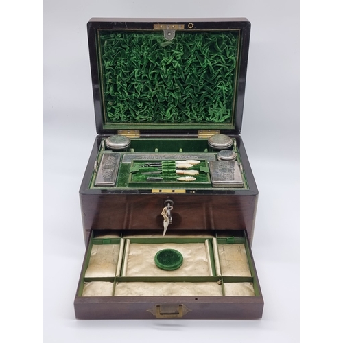 1449 - A Victorian rosewood and brass bound toilet box, the interior inscribed 'F. L. Hausburg, Manufacture... 