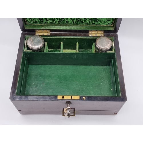 1449 - A Victorian rosewood and brass bound toilet box, the interior inscribed 'F. L. Hausburg, Manufacture... 
