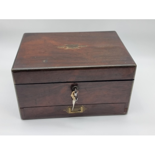 1449 - A Victorian rosewood and brass bound toilet box, the interior inscribed 'F. L. Hausburg, Manufacture... 