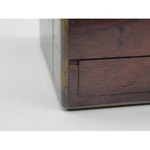 1449 - A Victorian rosewood and brass bound toilet box, the interior inscribed 'F. L. Hausburg, Manufacture... 