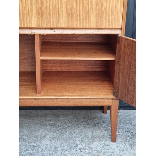 1018 - A mid-century Gordon Russell teak and walnut cocktail cabinet, 100.5cm wide.