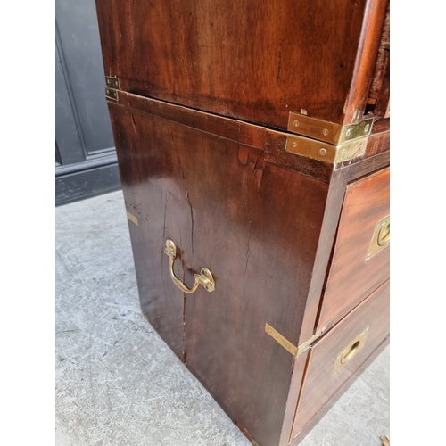 1039 - A 19th century mahogany and brass bound campaign style chest of drawers, in two parts, with counters... 