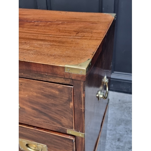 1039 - A 19th century mahogany and brass bound campaign style chest of drawers, in two parts, with counters... 