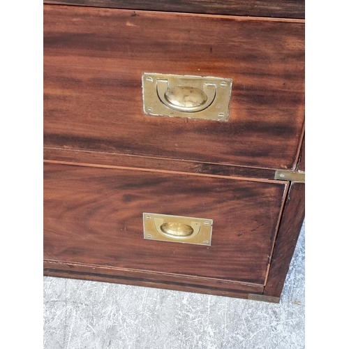 1039 - A 19th century mahogany and brass bound campaign style chest of drawers, in two parts, with counters... 